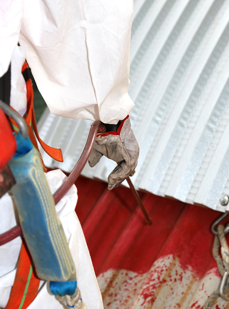 worker during the remediation of asbestos from the roof